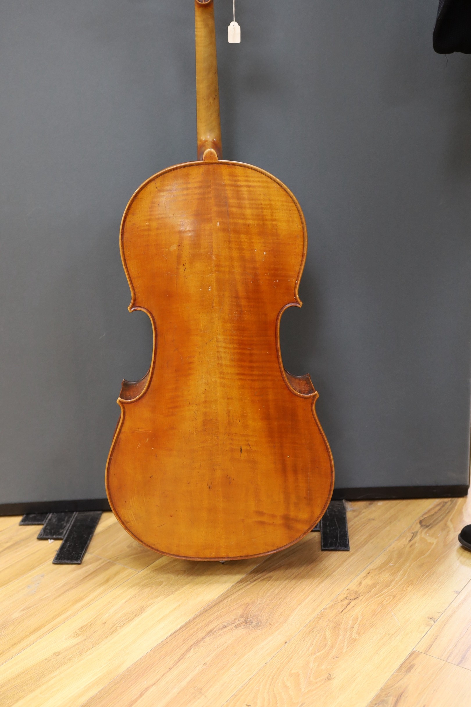 An early 20th century French half size cello, with soft case and bow